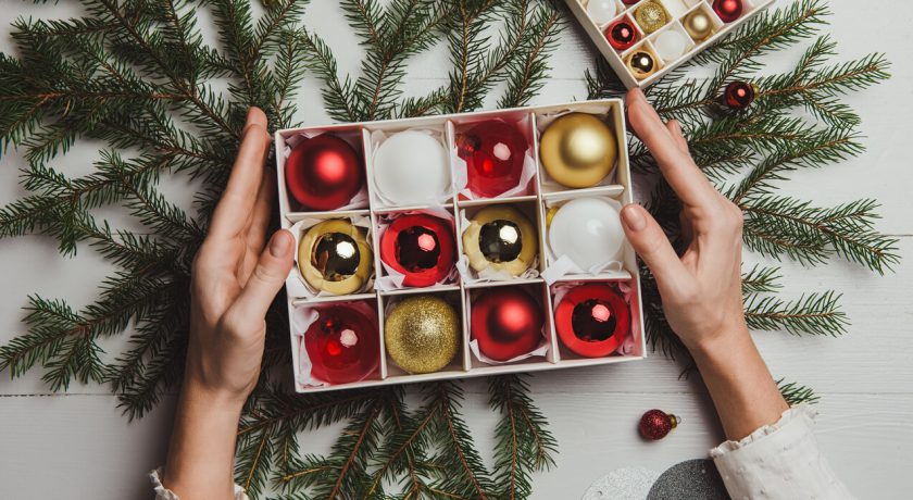 Christmas decoration from above overhead with woman hands