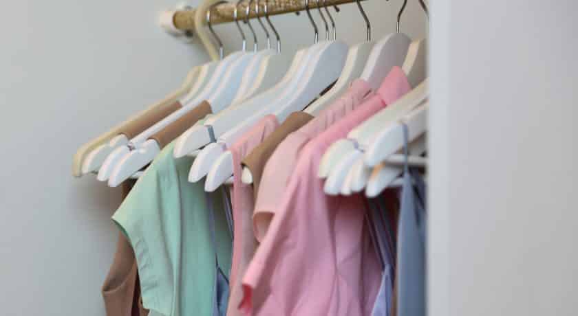 hangers with women's dresses and other colorful clothes